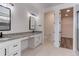 Double vanity bathroom, granite countertop, and walk-in closet at 4967 S Ukraine St, Aurora, CO 80015