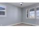 Well-lit bedroom with plantation shutters and neutral walls at 4967 S Ukraine St, Aurora, CO 80015