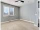 Spacious bedroom with neutral walls, carpet, and window shutters at 4967 S Ukraine St, Aurora, CO 80015