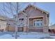 Two-story home with stone accents and a covered porch at 4967 S Ukraine St, Aurora, CO 80015