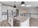 Modern kitchen features stainless steel appliances and white cabinets at 4967 S Ukraine St, Aurora, CO 80015