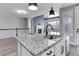 Kitchen island with granite countertop and stainless steel sink at 4967 S Ukraine St, Aurora, CO 80015