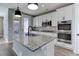 Eat-in kitchen with stainless steel appliances and island at 4967 S Ukraine St, Aurora, CO 80015