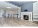 Living room features a fireplace and built-in shelving at 4967 S Ukraine St, Aurora, CO 80015