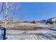 Residential street view, showcasing neighborhood homes and mailboxes with some snow at 4967 S Ukraine St, Aurora, CO 80015