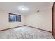 Finished basement bedroom with neutral paint, carpet, window, and wood trim at 3743 W 103Rd Dr, Westminster, CO 80031