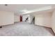 Spacious finished basement area with carpet, neutral paint, and stairs leading to the upper level at 3743 W 103Rd Dr, Westminster, CO 80031