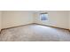 Finished basement bedroom with neutral paint, carpet, window, and wood trim at 3743 W 103Rd Dr, Westminster, CO 80031