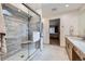 Modern bathroom featuring a glass shower and a vanity with stone countertop at 3743 W 103Rd Dr, Westminster, CO 80031