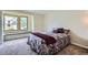 Bedroom with a bed, a bay window and burgundy accents at 3743 W 103Rd Dr, Westminster, CO 80031