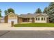 Charming single-story home with a brick facade, lush lawn, and attached two-car garage at 3743 W 103Rd Dr, Westminster, CO 80031