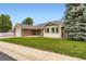 Beautiful single-story home with a brick facade and a well-manicured lawn at 3743 W 103Rd Dr, Westminster, CO 80031