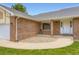 Inviting front entry of a brick home, featuring a cozy sitting area at 3743 W 103Rd Dr, Westminster, CO 80031