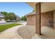 Close up of the home's front porch with brick columns, a seating area and gravel landscaping at 3743 W 103Rd Dr, Westminster, CO 80031