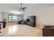 Spacious home office with hardwood floors, built-in shelving, and a ceiling fan at 3743 W 103Rd Dr, Westminster, CO 80031