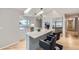 Bright, modern kitchen with an island, stainless steel appliances, and stylish lighting at 3743 W 103Rd Dr, Westminster, CO 80031