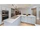 Bright kitchen with stainless steel appliances, updated cabinets, and an eat-in island at 3743 W 103Rd Dr, Westminster, CO 80031