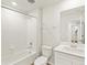 Bright bathroom featuring a shower-tub combo, white vanity, and neutral decor at 755 N Tibet St, Aurora, CO 80018