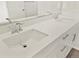 Bright bathroom featuring a double sink vanity with modern fixtures and a large mirror at 755 N Tibet St, Aurora, CO 80018