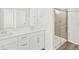 Bathroom with double sink vanity and tiled shower at 755 N Tibet St, Aurora, CO 80018