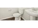 Powder room featuring a pedestal sink and modern fixtures at 755 N Tibet St, Aurora, CO 80018