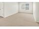Bright bedroom featuring neutral carpeting and a large window at 755 N Tibet St, Aurora, CO 80018