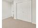 Empty bedroom featuring neutral carpet and a large double door closet at 755 N Tibet St, Aurora, CO 80018