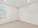 Empty bedroom with neutral carpet, window, and recessed lighting at 755 N Tibet St, Aurora, CO 80018