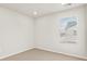Bright, empty bedroom featuring neutral carpet, recessed lighting, and a window at 755 N Tibet St, Aurora, CO 80018