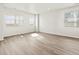 Bright, spacious living room featuring hardwood floors and multiple windows for ample natural light at 755 N Tibet St, Aurora, CO 80018
