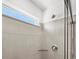 Shower featuring tiled walls, window, and glass door at 755 N Tibet St, Aurora, CO 80018
