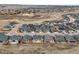 Aerial view of a neighborhood with many homes and winding roads at 7268 Greenwater Cir, Castle Rock, CO 80108