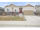 Charming home with stone accents, a two-car garage, and a well-maintained lawn at 7268 Greenwater Cir, Castle Rock, CO 80108