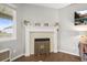 Cozy fireplace with white mantel, decorative tile, and hearth provides a focal point in the living space at 7268 Greenwater Cir, Castle Rock, CO 80108