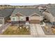 Charming single-Gathering home features a well-maintained lawn, a two-car garage, and a red front door at 7268 Greenwater Cir, Castle Rock, CO 80108