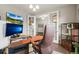 Cozy home office featuring a unique desk setup, dual monitors, and comfortable leather chair at 7268 Greenwater Cir, Castle Rock, CO 80108