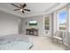 Spacious main bedroom featuring a decorative fireplace console and access to the balcony at 7268 Greenwater Cir, Castle Rock, CO 80108