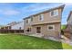 This backyard features a well-maintained lawn, wooden deck, and privacy fence, perfect for relaxing and entertaining at 13486 Clayton St, Thornton, CO 80241