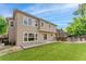 Enjoy a well-maintained backyard with a green lawn, wooden deck, and privacy fence, perfect for outdoor entertaining at 13486 Clayton St, Thornton, CO 80241