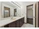 Large bathroom featuring double sinks and bright light at 13486 Clayton St, Thornton, CO 80241