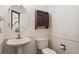 Half bath featuring pedestal sink and modern fixtures at 13486 Clayton St, Thornton, CO 80241