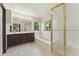 Bright primary bathroom with double sinks, soaking tub, and shower at 13486 Clayton St, Thornton, CO 80241