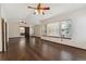 Spacious room with hardwood floors, large windows and wood trim at 13486 Clayton St, Thornton, CO 80241