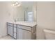 Bathroom with double vanity and gray cabinets at 16630 E Virginia Ave, Aurora, CO 80017