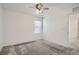 Simple bedroom with window, ceiling fan, and closet at 16630 E Virginia Ave, Aurora, CO 80017