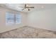 Well-lit bedroom with two windows and ceiling fan at 16630 E Virginia Ave, Aurora, CO 80017