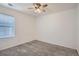 Bright bedroom with ceiling fan and window blinds at 16630 E Virginia Ave, Aurora, CO 80017