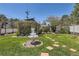 Charming backyard featuring lush lawn, stone pathway, and a lovely water fountain feature at 1701 Kingston St, Aurora, CO 80010