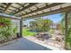 Inviting backyard featuring lush lawn, mature tree, and a covered patio for outdoor enjoyment at 1701 Kingston St, Aurora, CO 80010