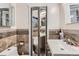 Bathroom featuring mirrored bi-fold door accessing the toilet and tub/shower at 1701 Kingston St, Aurora, CO 80010